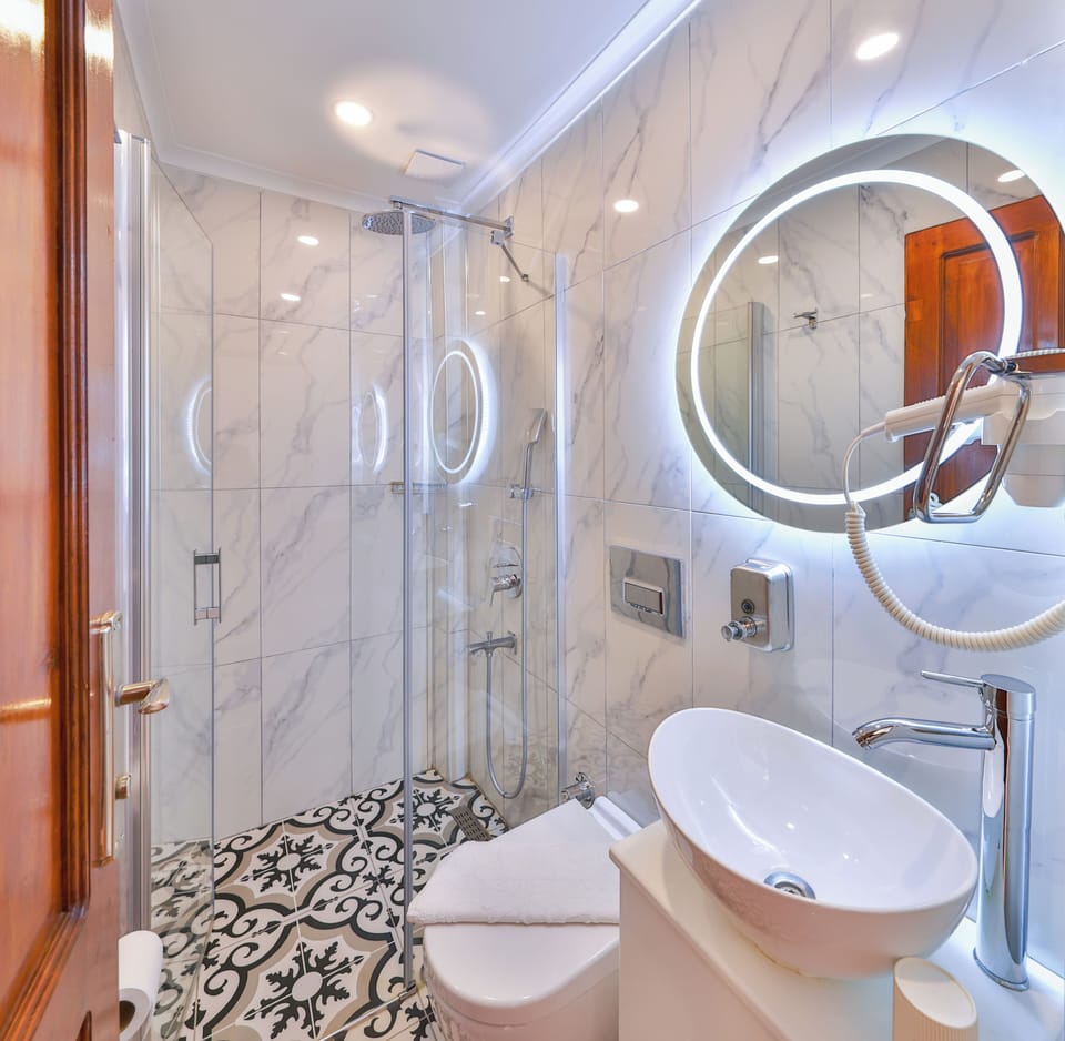 Shower, hair dryer, slippers, towels