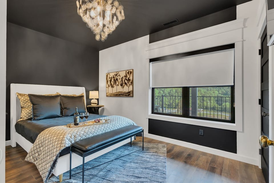 Cozy and stylish main floor bedroom featuring a plush queen bed and a private en-suite bath for your convenience and comfort. Ideal for couples or solo travelers seeking privacy and ease of access.