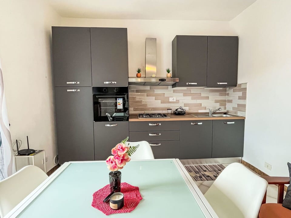 Kitchen, Kitchen Appliance, Furniture, Countertop, Cabinetry, Major Appliance, Interior Design, Wood, Flooring, Kitchen Stove