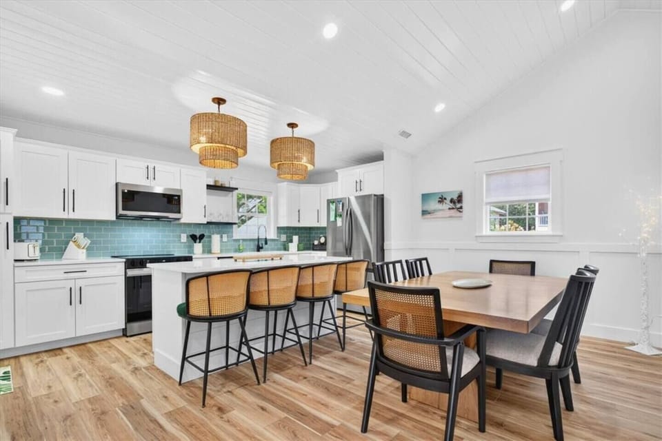 With island seating for up to four and a full dining table nearby, the layout is thoughtfully designed so all eight guests can gather and dine comfortably in one connected space.