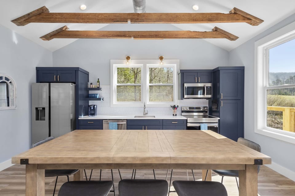 Kitchen | A Bright, Fully-Equipped Space with Dining Table for Effortless Cooking and Connection