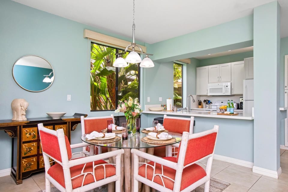 Chic dining area with bold island colors and seating for four

