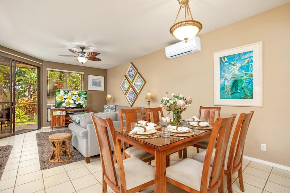 Warm dining area with seating for six and garden views