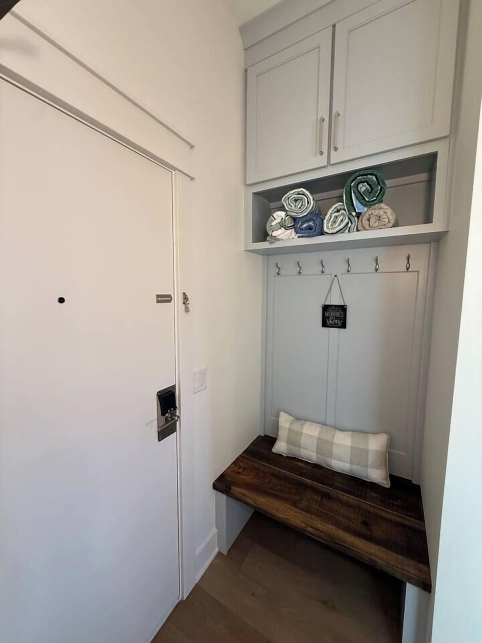 At the entrance, enjoy a barn-wood bench with hooks for coats and shoes underneath. 