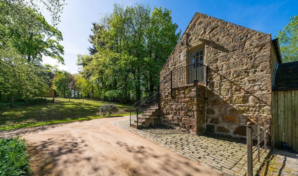 Exterior and entrance via the stone staircase