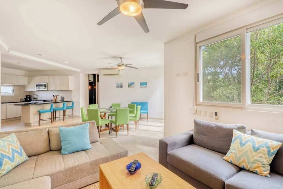 Bright living room with sofa and flat-screen TV