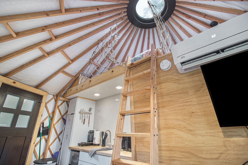 Green yurt loft area