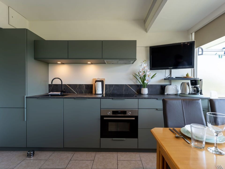 Kitchen, Countertop, Kitchen Appliance, Cabinetry, Major Appliance, Home Appliance, Interior Design, Kitchen Stove, Furniture, Flooring