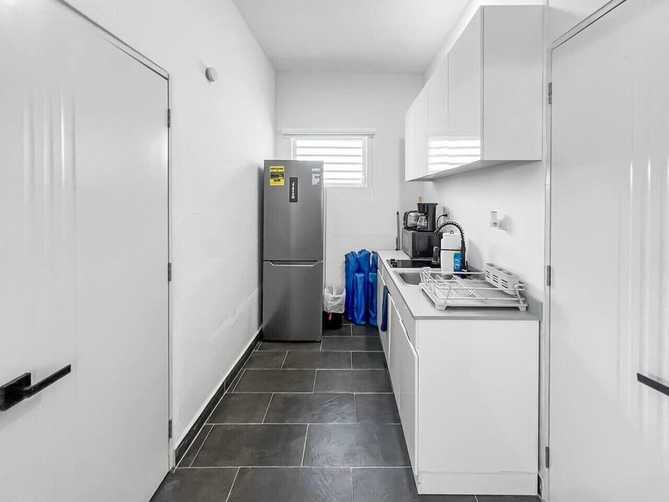A fully equipped modern kitchen designed for convenience and efficiency.