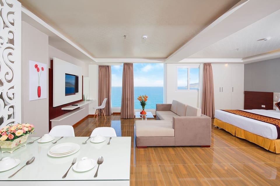 Apartment, 1 Bedroom, Sea View | Living area | 32-inch flat-screen TV with cable channels, TV, books