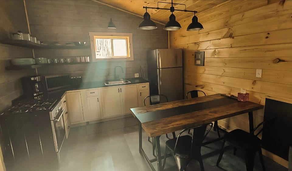 microwave, coffee maker, kitchen, oven, refrigerator, stovetop, dining table