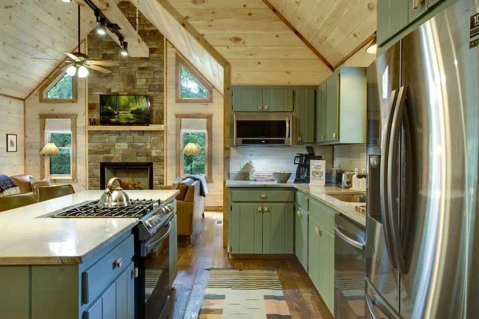 SAGE-TONED CUSTOM CABINETRY & POLISHED STONE COUNTERTOPS