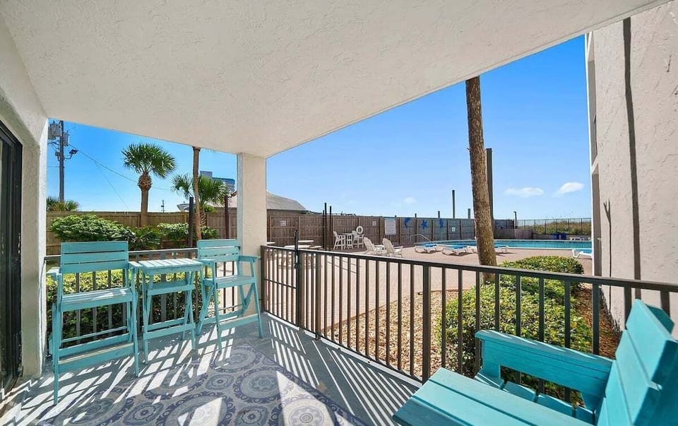 Spacious balcony with seating and scenic views