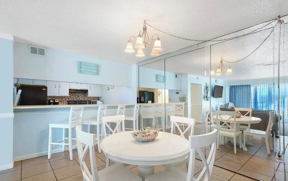 Dining table and breakfast bar in kitchen area