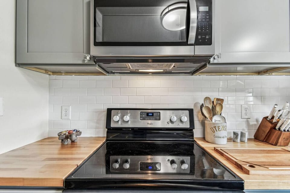 Kitchen: Modern appliances and chic decor await your culinary adventures in sunny Sorrento!