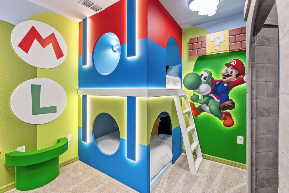 This colorful children's room features a playful bunk bed designed like a whimsical playhouse, with vibrant Mario murals and cheerful green and blue walls, creating a lively space perfect for fun adventures and restful nights.