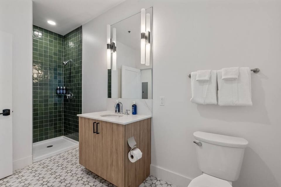 Rinse off and reset with a clean, modern walk-in shower.