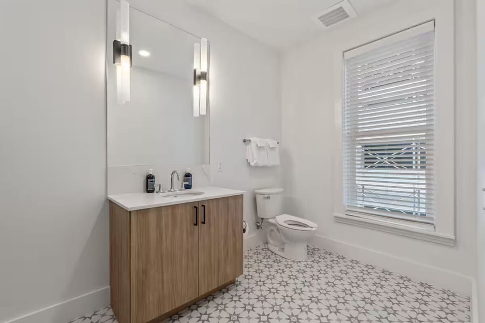 Refresh comfortably with bright lighting and a spacious vanity area.
