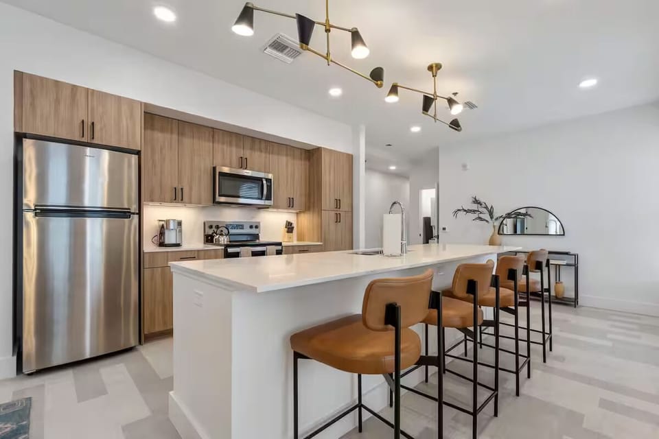 Cook and connect around the oversized island with bar seating.