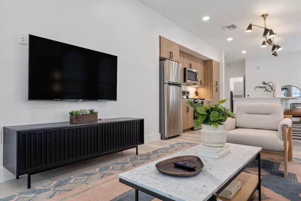 Kick back with a big-screen TV in a bright lounge.