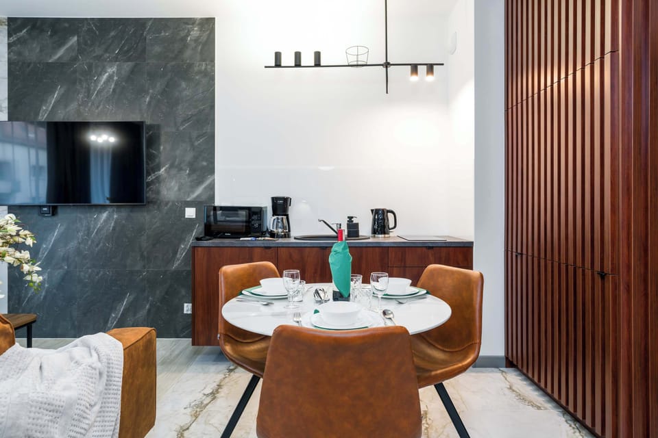 Large table with chairs for eating communal meals. 