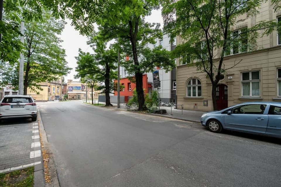Street view of the surrounding neighborhood, featuring historic architecture and tree-lined walkways.







