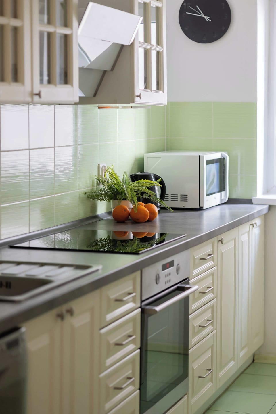 Bright kitchen with cooking utensils. 