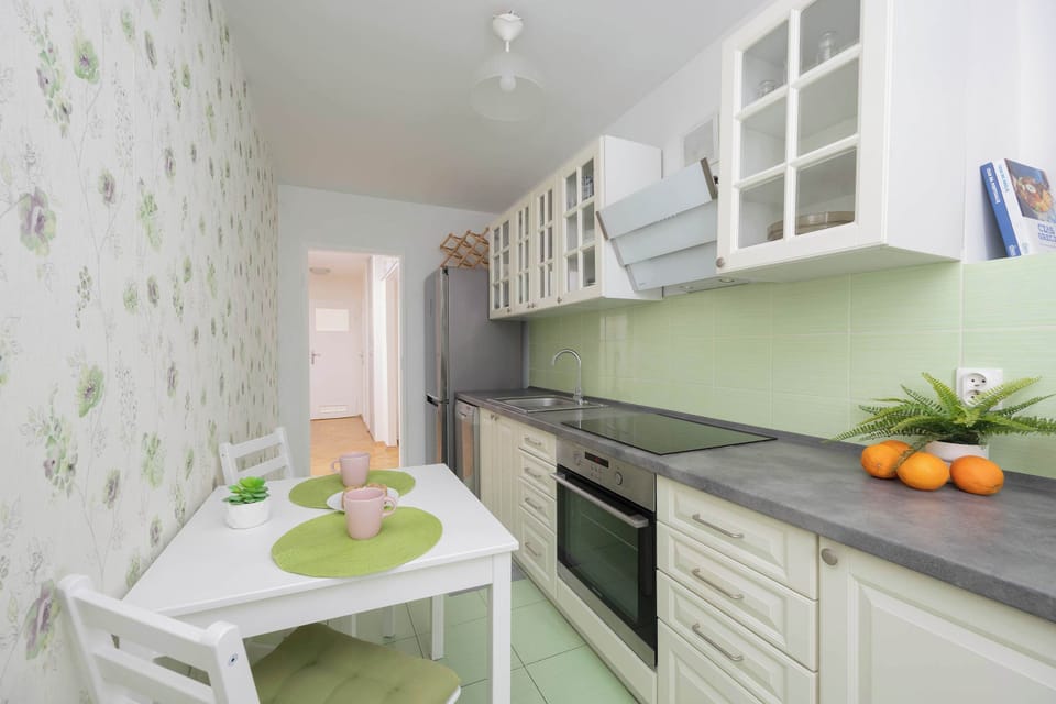 Bright kitchen with cooking utensils. 