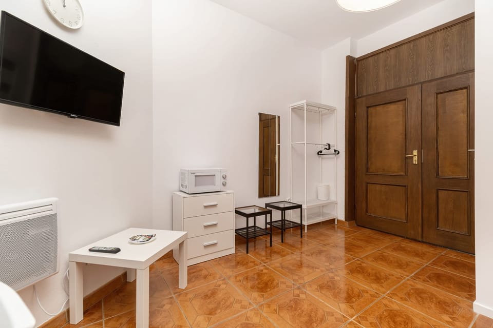 Enjoy your favorite shows on the flat-screen television in the elegant living area.