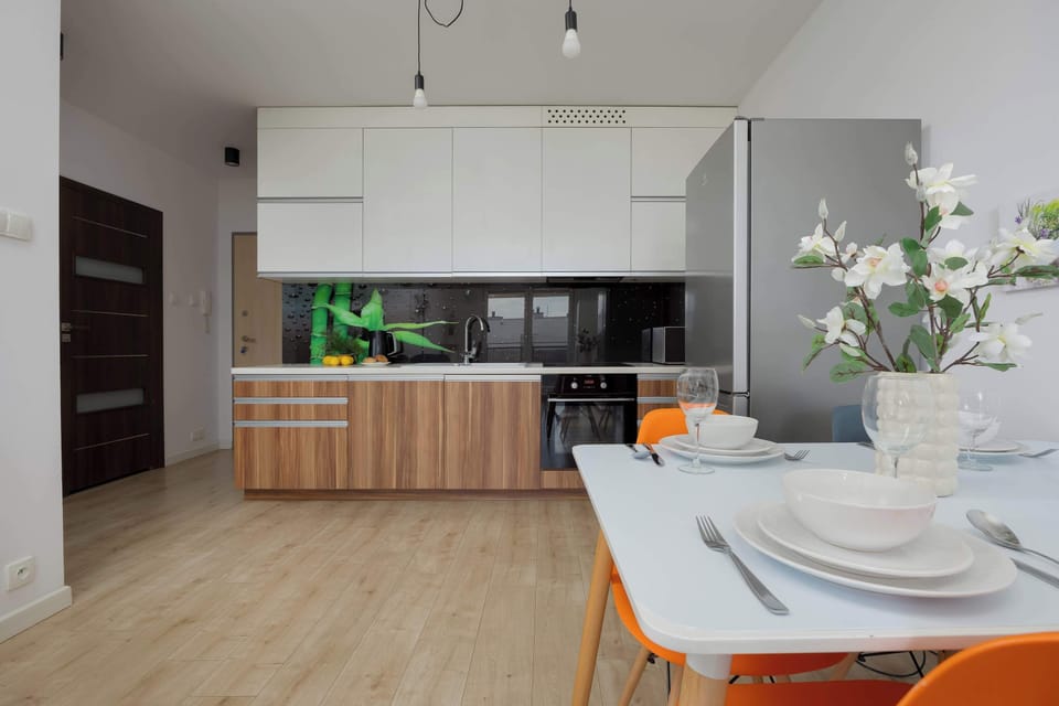 A modern kitchen with dining space offers comfort for cooking and sharing meals together.


