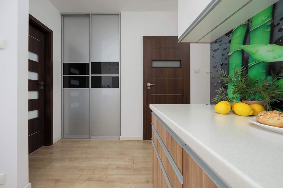 A bright, functional transition between the kitchen and lounge area makes daily living more convenient.