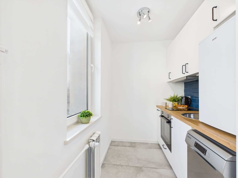 Another perspective of the modern kitchenette, highlighting the efficient use of space.