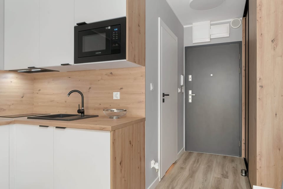 Practical kitchenette with functional equipment.