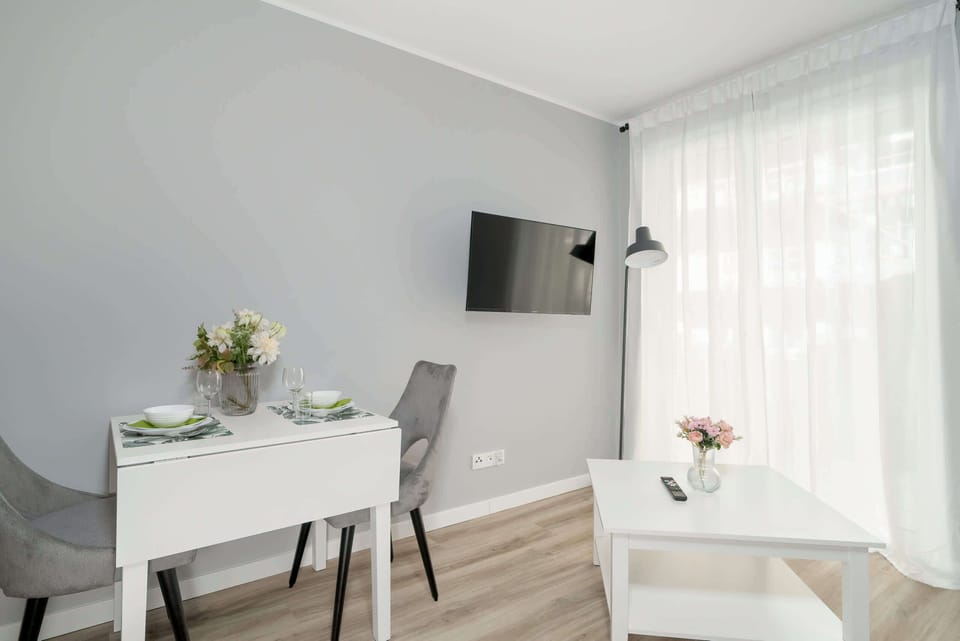 Living area equipped with a flat-screen television.