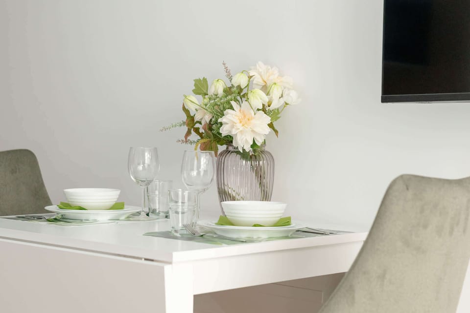 Dining area located next to the television.