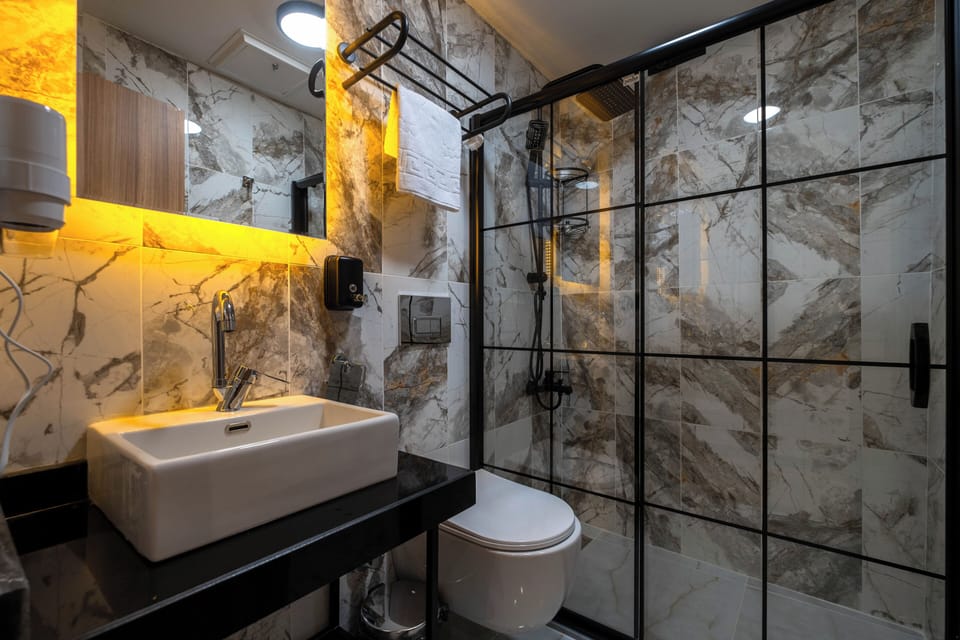 Shower, free toiletries, hair dryer, slippers