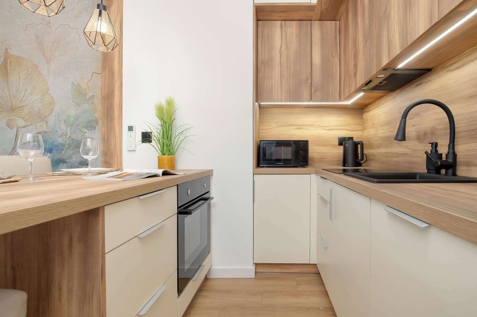 Kitchenette with oven and refrigerator.