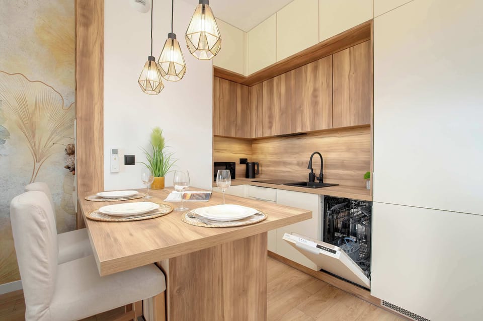 Kitchenette with oven and refrigerator.