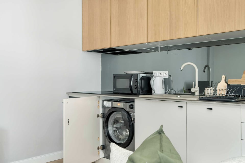The fully equipped kitchenette includes everything you need for a home-cooked meal.