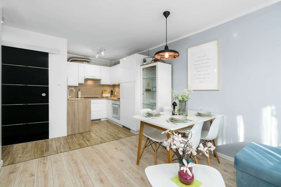 Kitchenette with oven and refrigerator. 