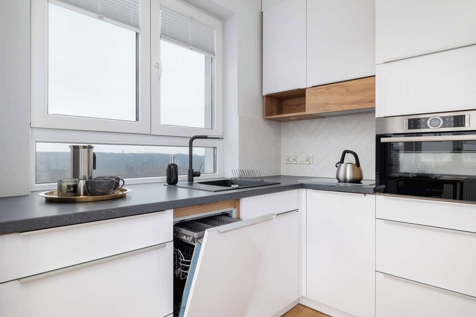 Kitchenette with oven and refrigerator. 