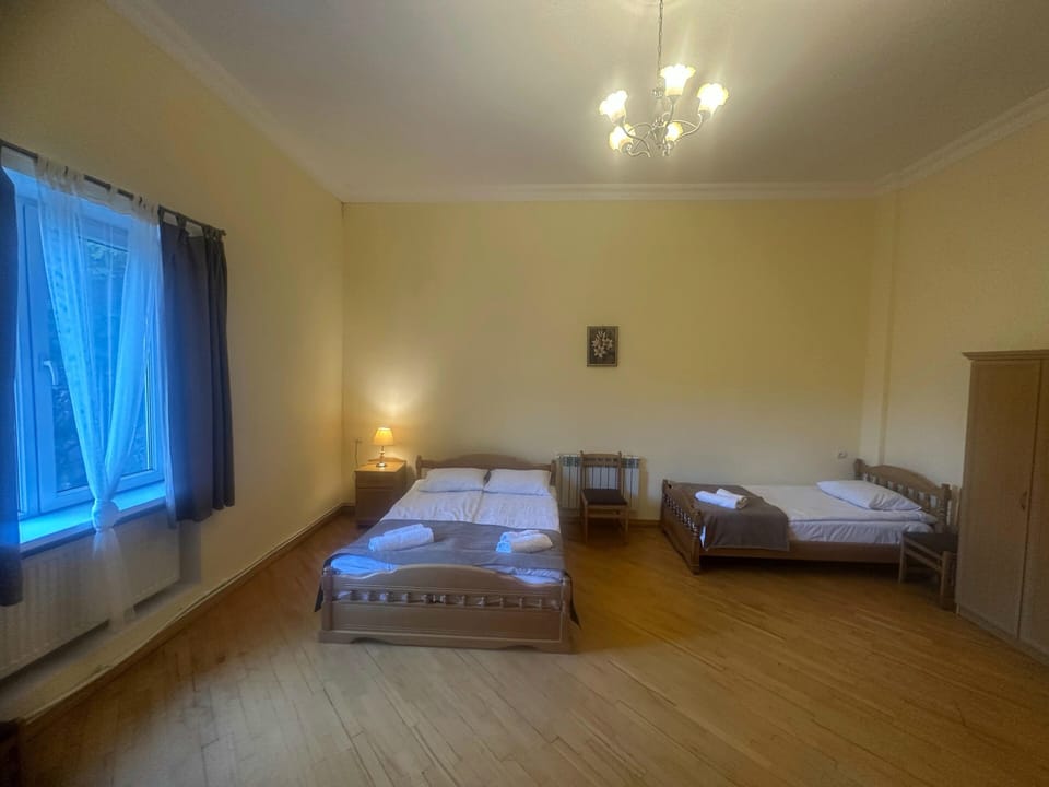 Basic Triple Room, Garden View | Desk, laptop workspace, soundproofing, iron/ironing board
