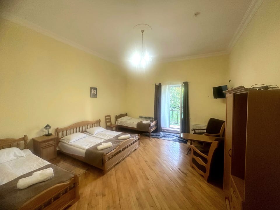 Quadruple Room, Balcony, Garden View | Desk, laptop workspace, soundproofing, iron/ironing board