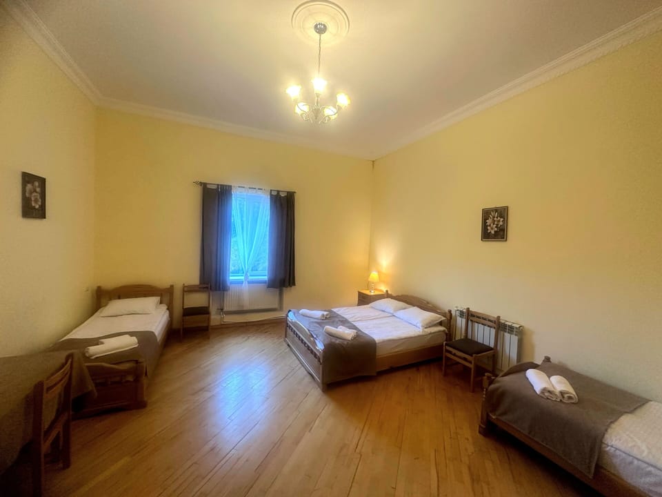 Basic Triple Room, Garden View | Desk, laptop workspace, soundproofing, iron/ironing board