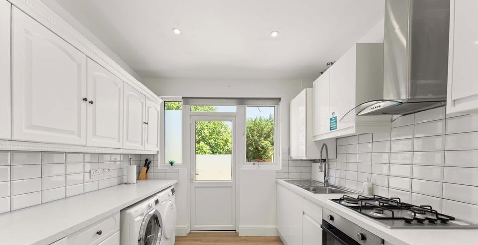 A bright and clean kitchen that’s fully equipped with everything you need—perfect for cooking, snacking, or enjoying a quiet cup of coffee.
