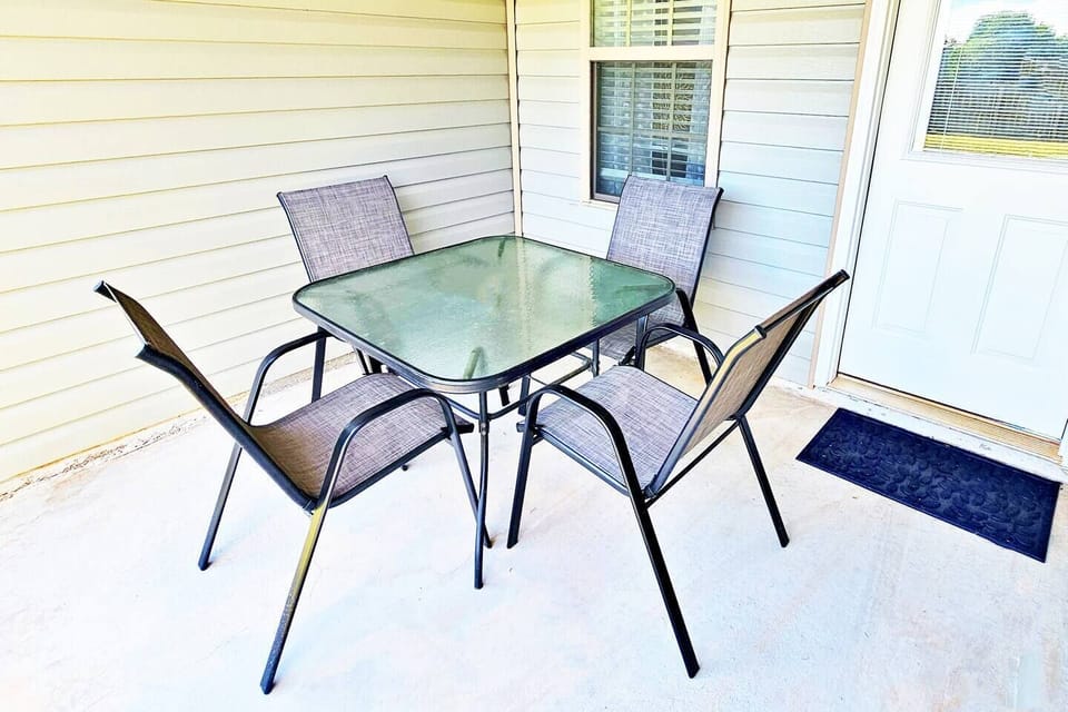 It is located right off the main room in the back. Perfect for 4 to enjoy at sunset or sunrise. Fenced-in backyard for privacy.