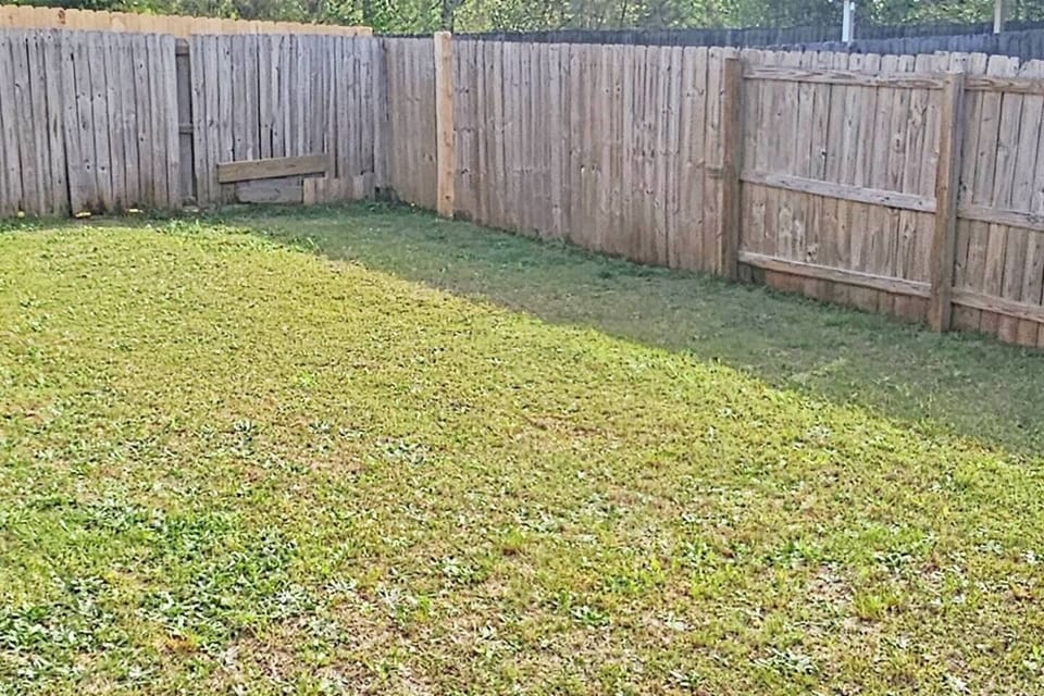 Privacy fenced-in backyard with plenty of space. 