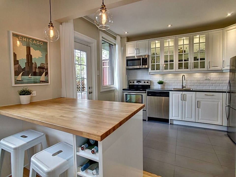 Kitchen with breakfast bar and small back balcony 