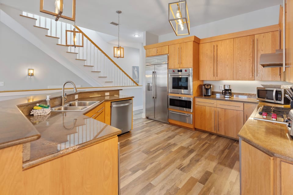 Your gourmet kitchen features premium appliances and granite counters, perfect for preparing memorable meals during your stay.