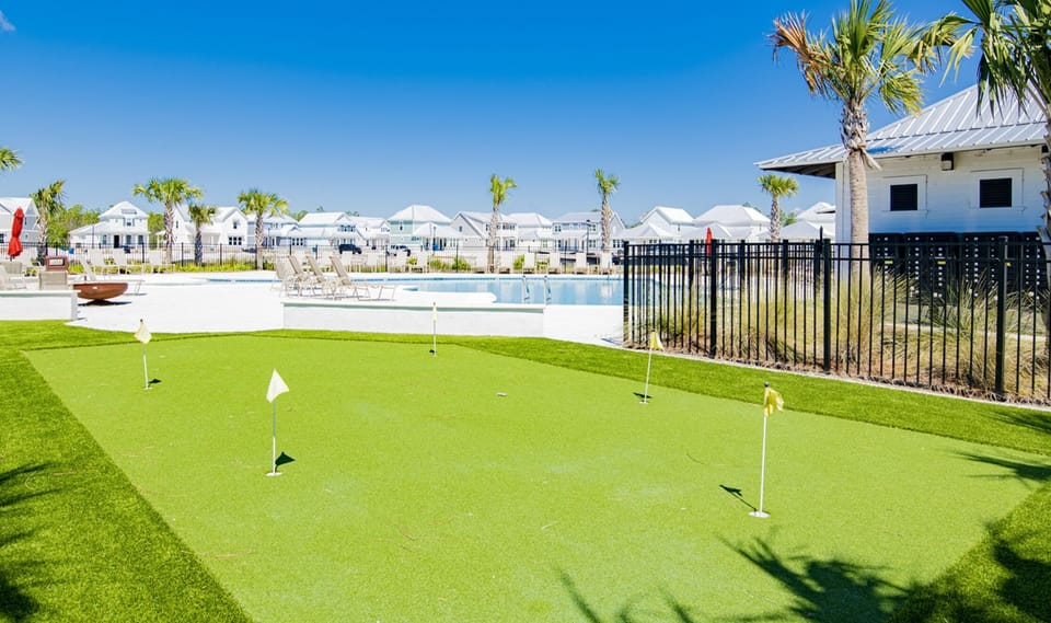 Enjoy friendly competition or practice your putt at the neighborhood’s mini putting green, conveniently located by the pool area for fun and relaxation a quick golf cart ride from your door.